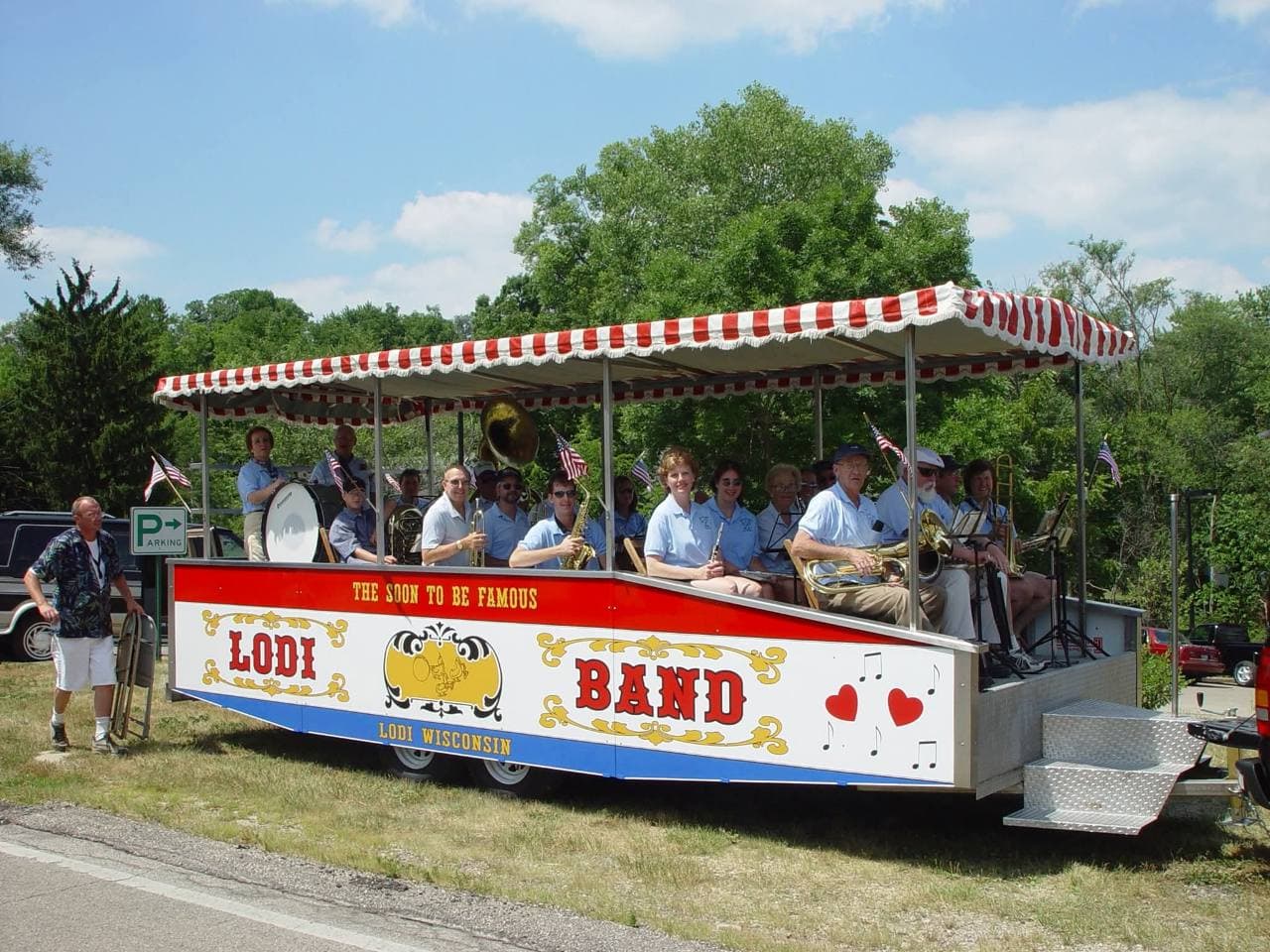 The Lodi Soon-to-Be Famous Band with their instruments aboard the red, white, and blue band wagon.